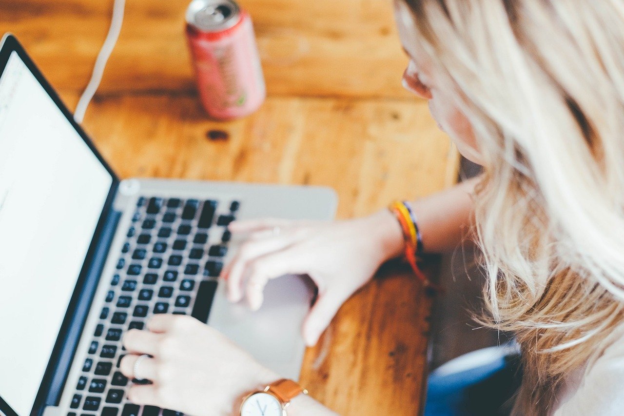 A photographer managing her business from her laptop